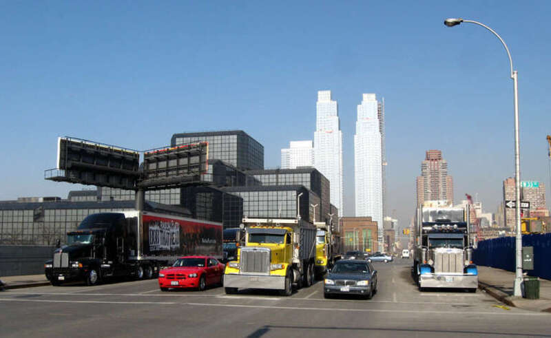 Looking north on en:Eleventh Avenue (Manhattan) from 33rd Street at en:Silver Towers on a sunny early afternoon.