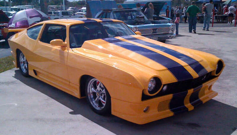 1974 AMC Matador custom 401 CID V8 coupe finished in yellow with purple stripes, right side view
