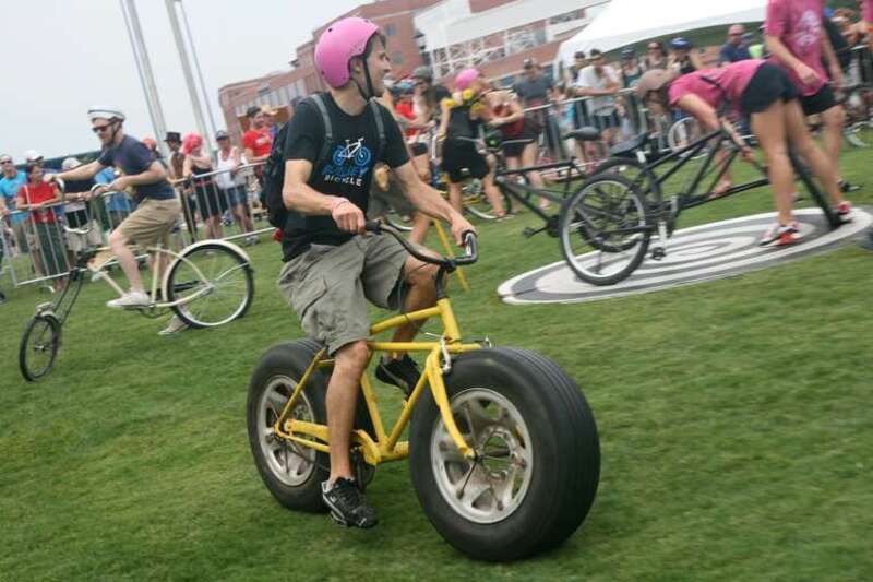 People are allowed to try the imaginative custom bicycles at the New Belgium Tour de Fat event in Durham, North Carolina.