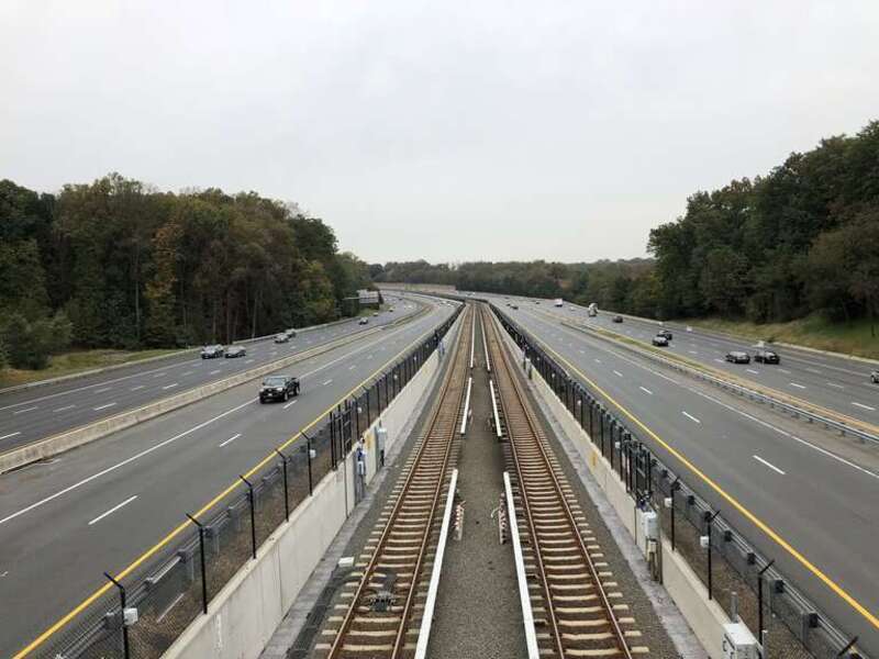 View west along Virginia State Route 267 (Dulles Toll and Access Roads) and the Silver Line of the Washington Metro from the overpass for Virginia State Route 676 (Trap Road) in Wolf Trap, Fairfax County, Virginia
