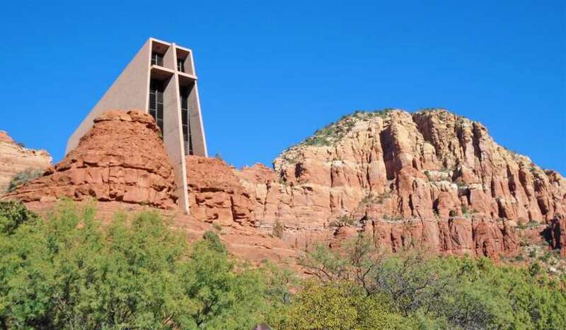 2021 Chapel of the Holy Cross from left below, wide.jpg The Chapel of the Holy Cross is a Roman Catholic chapel built from 1954 to 1956 into the red rock buttes of Sedona, Arizona, within the Coconino National Forest. It was inspired and commissioned by local rancher and sculptor Marguerite Brunswig