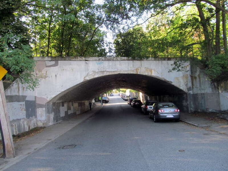 Arch bridge carrying the Needham Line (and formerly the West Roxbury Branch) over Temple Street, photographed in September 2016