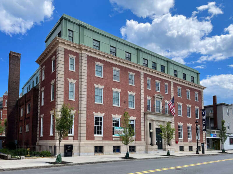Shown is a YMCA in Beverly, Massachusetts, built in 1901. In 2021 it was converted into affordable housing, comprising 67 studio apartments. It is still operated by the YMCA.