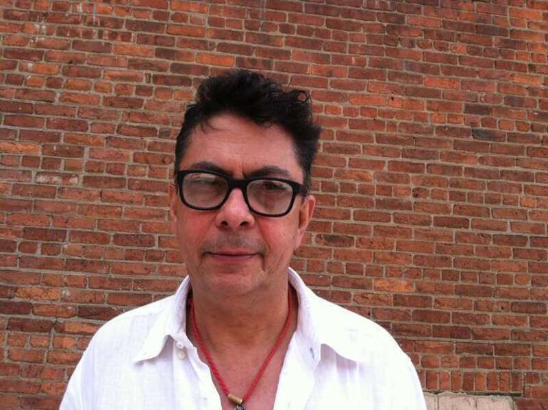 This is a photograph of the artist Chittrovanu Mazumdar in front of the Mana Contemporary Art gallery in Jersey City, NJ