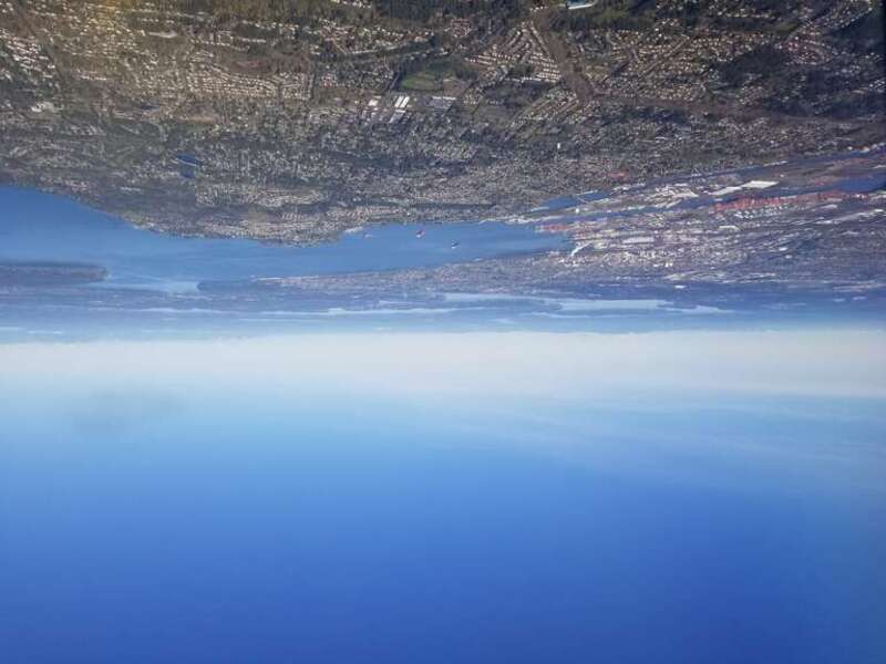 Taken of Commencement Bay (part of Puget Sound) while on an air plain. Include surrounding areas such as downtown Tacoma, Point Defiance, Gig Harbor, Fox Island, the Key Peninsula, Ketron Island, Anderson Island, McNeil Island, Thurston County, and