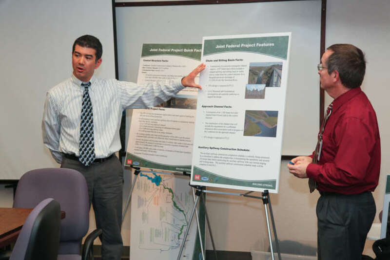 FOLSOM, Calif. (Feb. 4, 2011) - Civil works project manager Jason Magness (left) and project management team member Roger Henderson, both with the U.S. Army Corps of Engineers Sacramento District, explain the construction of the auxiliary spillway at