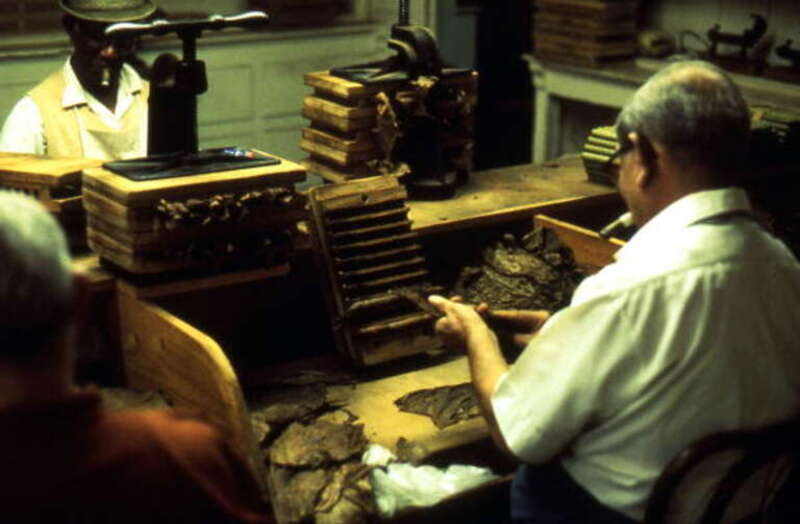 Local call number: FS85691Title: Cuban cigar makers at work: Ybor City, FloridaDate: 1974Photographer: http://www.floridamemory.com/solr-search/results/?q=collection:%22Florida Photographic Collection&quot; AND photographer:&quot;Loomis, Ormond H.,