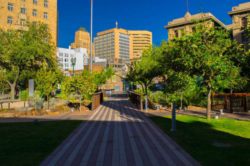 500px provided description: Down The Pathway [#sky ,#city ,#sunset ,#street ,#downtown ,#urban ,#architecture ,#building ,#plaza ,#Texas]
