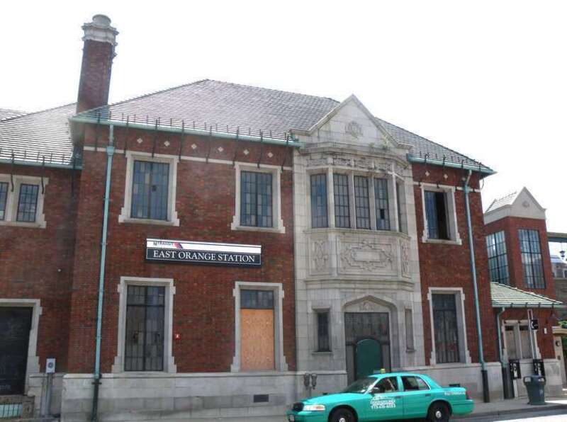 Looking southwest at station house of en:East Orange (NJT station) on a mostly sunny midday.  Elevator to westbound platform is in the separate tower to the right.  See also File:East Orange Station under jeh.jpg.