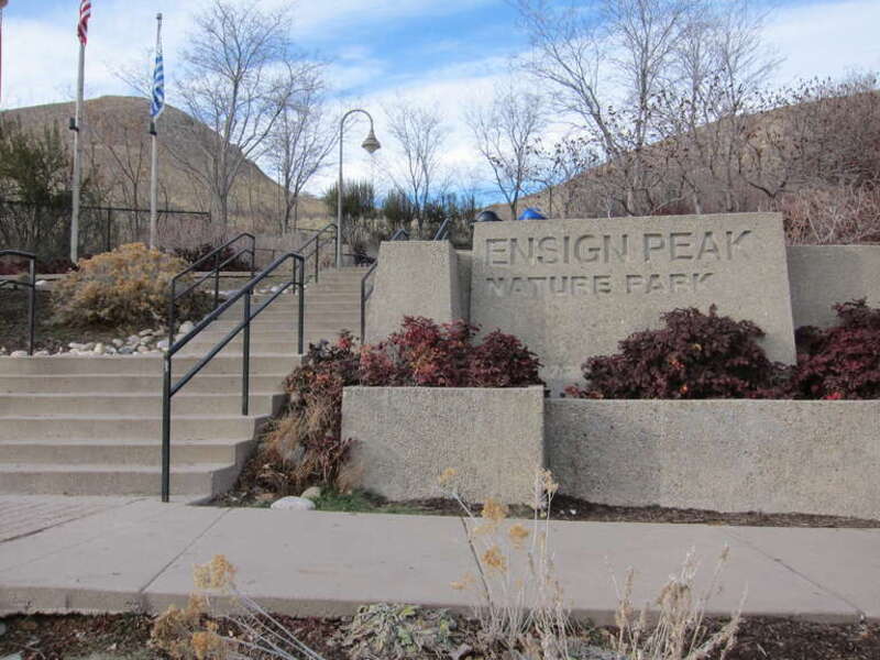 The entrance to and sign for Ensign Peak Nature Park with stairs leading up to it on the left. Managed by the Salt Lake City Public Lands Department.  Ensign Vista Drive, Salt Lake City, Utah.