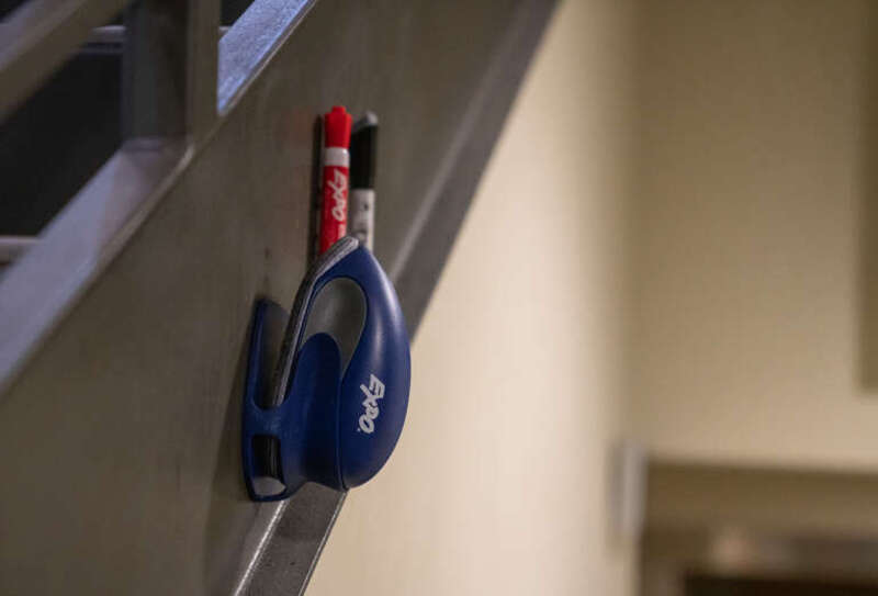 An Expo dry erase board set of red and black markers.