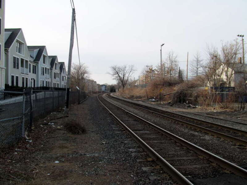 Fitchburg Line corridor, looking west from Park Street in Somerville. Somerville station, closed in 1938, was located on the north side of the tracks at the right side of the photo.