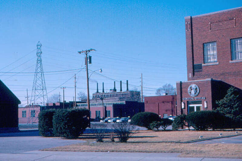 The general office of Indiana &amp;amp; Michigan Electric Co. is at right.  The company was headquartered in Fort Wayne, but electric power in the city was supplied by a city-owned utility, called City Light.  Their power plant is in the background.