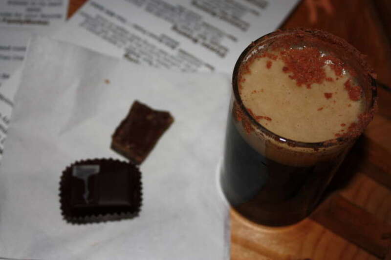Here is a chocolate-rimmed brew - the Abominable from host Fremont Brewing - with its pairing (Theo coconut curry) and a ganache-filled chocolate in background. Fremont had our favorite brew of the evening - its Specialty beer &quot;Susan&quot; was a &quot;unique