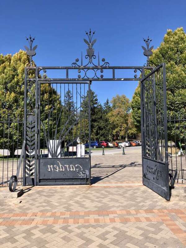 This image depicts the entrance gate to the Sunken Gardens at Garfield Park in Indianapolis, Indiana, U.S. Designed by landscape architect George Kessler, the gardens debuted in 1916.