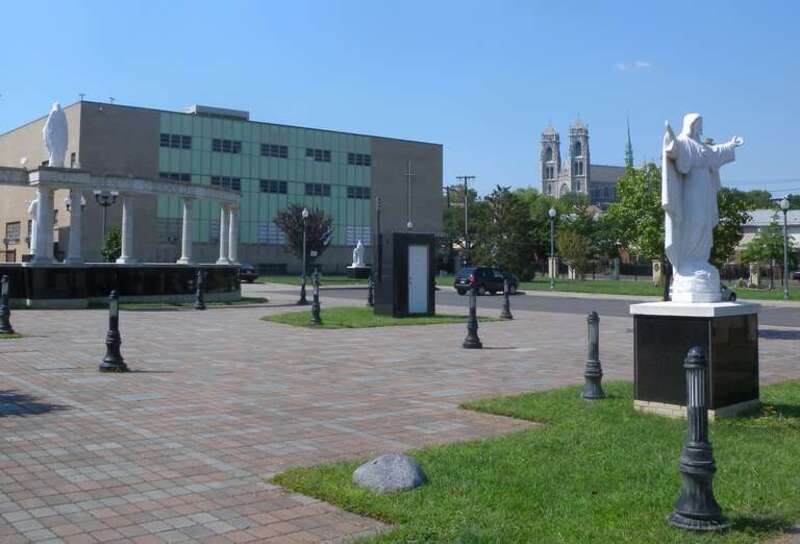 Looking northwest at Shrine of St Gerard on a sunny early afternoon.  School of File:Lucy RCC Newark jeh.jpg is in background left and Sacred Heart Basilica in distance right.