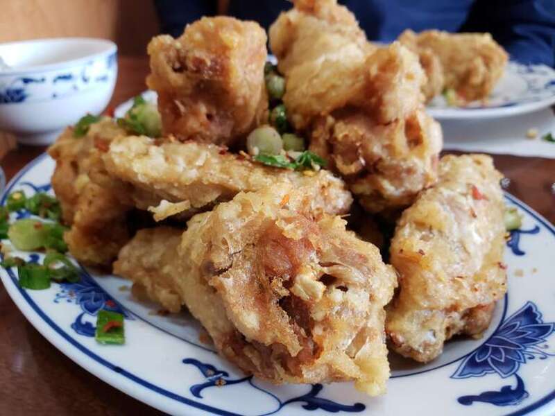 A lunch size serving of Chicken Wing Dpicy Salt served at a Chinese American cuisine restaurant off Plaza Boulevard in National City, California.