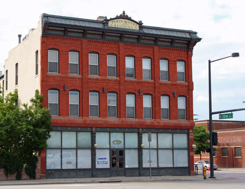 The George Hamburger Block, located at 2199 Arapahoe Street in Denver, Colorado. A sign at the top of the structure reads, &quot;Paris Hotel Building.&quot;