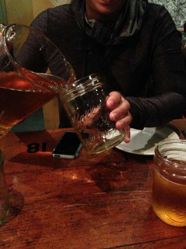 A photo series featuring drinks in jars, with Apple products in the background.