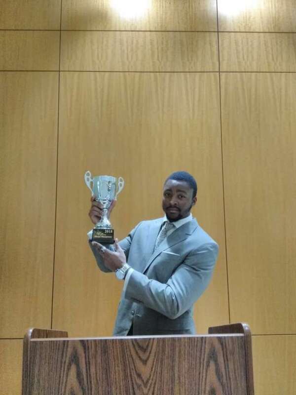 This is a photo of D'Vaughn Bell, Marqui Management CEO, speaking at an event and receiving an award.