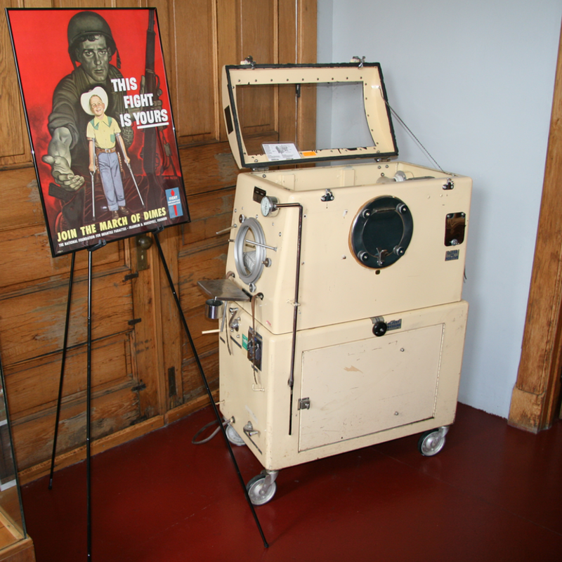 An infant-sized mechanical respirator (or &quot;iron lung&quot;) on display in the Indiana Medical History Museum in Indianapolis, Indiana.  The museum occupies the old Pathology Building at the Central State Hospital campus on West Vermont Street.