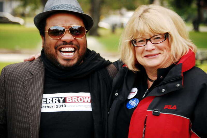 Cindy Harris, Event Coordinator and Volunteer Campaign Coordinator for Jerry Brown, makes nice with Nicholas Hatten at the Jerry Brown rally in Victory Park, Stockton. Three days to go before the election &amp;amp; the push is on...