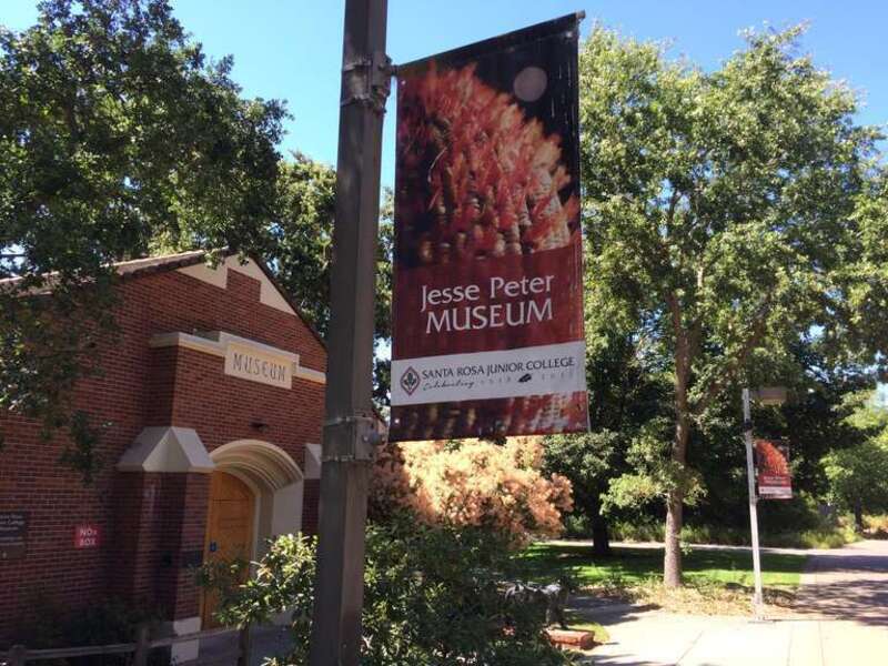 The front of the SRJC Multicultural Museum with Jesse Peter Museum banners prominently displayed.  This was more than three months after the SRJC Board voted to remove all references to Jesse Peter, Jr. from the Museum name.