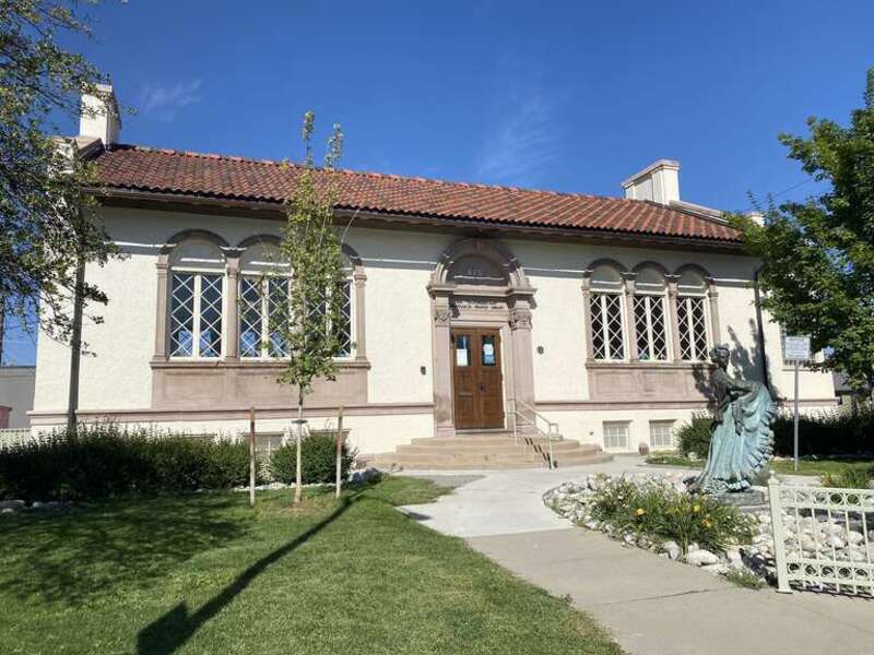 The exterior of the John &quot;Thunderbird Man&quot; Emhoolah, Jr. Branch Library in Denver, Colorado, in 2022. The building is a Carnegie library that was renamed in 2021.