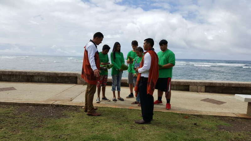 Youth leaders learning traditional Hawaiian ground blessing practices at the ground breaking of Kupu's new community center.

Kupu is a Forest Service partner that provides hands-on training to educate and mentor youth to become stewards of the
