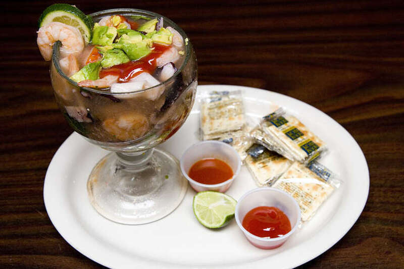 A seafood delight of rock prawns and octopus in a lightly spiced tomato broth, topped with avocado slices, onion, tomato, cilantro, and fresh squeezed lime juice.  Served with crackers.
El Balazo

Pleasanton Calif