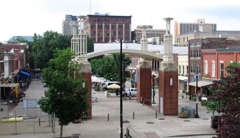 The north end of the Market Square in Knoxville, Tennessee, USA, viewed from the TVA towers courtyard.  The square's stage dominates the view at the center.  The seven-story Arnstein Building rises top-center.