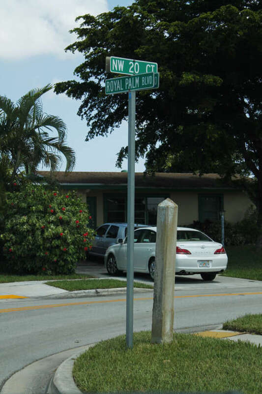 Old concrete sign post in Margate, Florida.