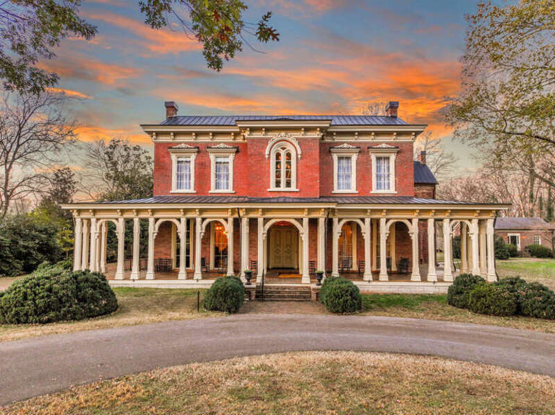 A picture of Oaklands Mansion during sunset that showcases all its beauty