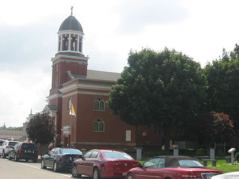 Western side and front of Our Lady of Mount Carmel Church, located at 343 Via Mount Carmel Avenue in Youngstown, Ohio, United States.  Built in 1913, it is listed on the National Register of Historic Places.