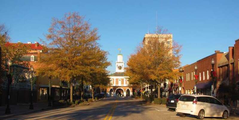 Looking west on Person Street in downtown Fayetteville, North Carolina in Cumberland County with the historic Market House in the center and the Self Help Building to the right.