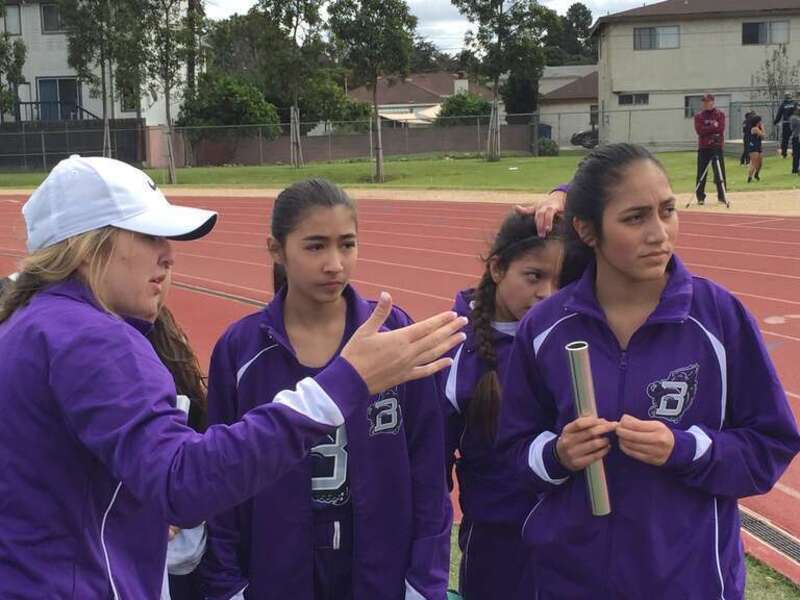 Athletic Director Brooklin Brumund with track &amp;amp; field athletes