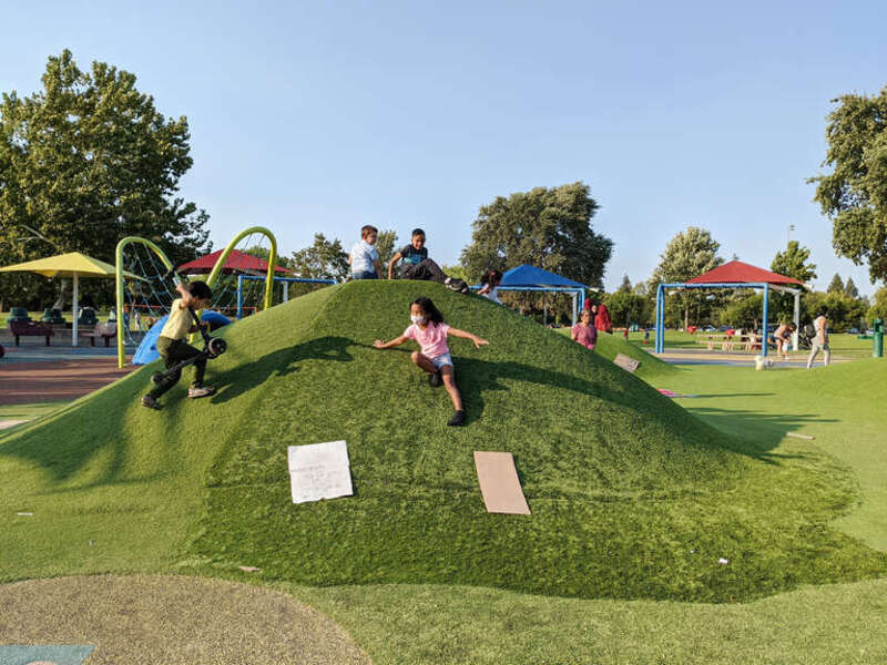 Children play at the all-abilities playground at Heather Farm Park in Walnut Creek, CA