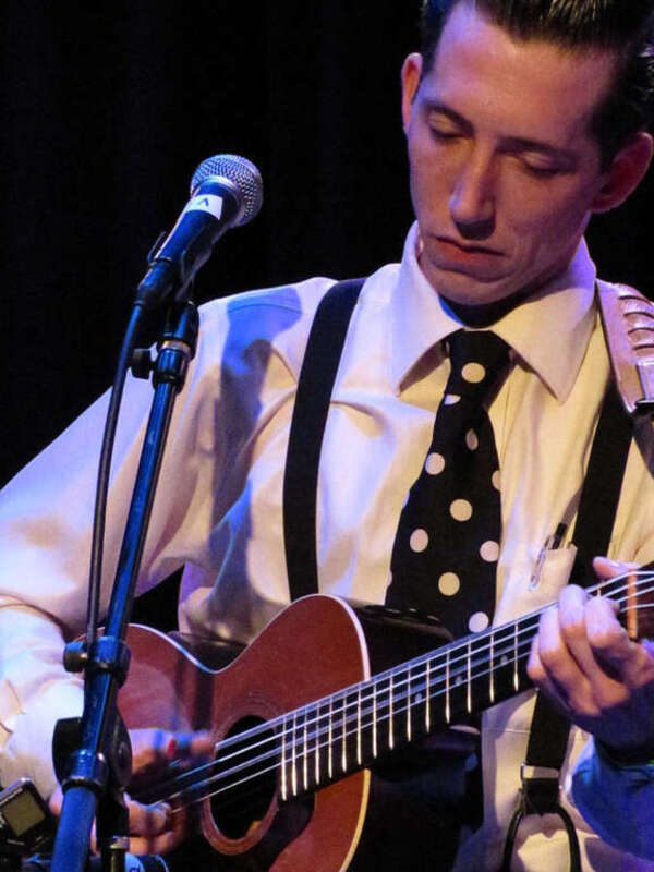 Pokey LaFarge plays guitar at the Square Room in Knoxville, TN on April 17, 2010.