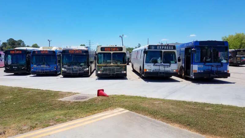 At the garage of the Charleston Area Regional Transportation Authority (CARTA) (in South Carolina), a posed line-up of six different types of buses in CARTA's fleet.  Left to right:  3001 (a New Flyer MD30), 3511 (New Flyer D35LFR), 4002 (New Flyer