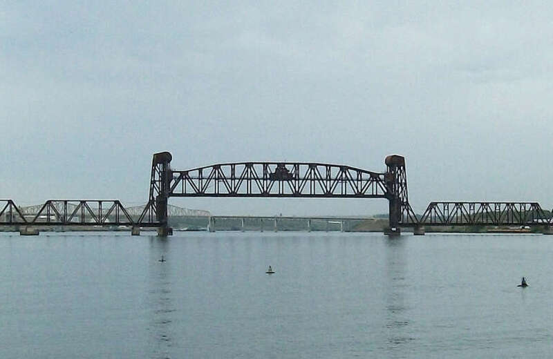 A railroad lift bridge over the Snake River. The Vaughn Hubbard bridge is visible in the background.