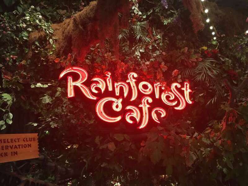 A neon-sign welcomes visitors outside a Rainforest Cafe, located inside the Great Lakes Crossing shopping complex in Auburn Hills, Michigan.