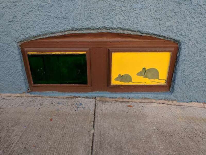 Rat window art in Hampden, Baltimore, Maryland.