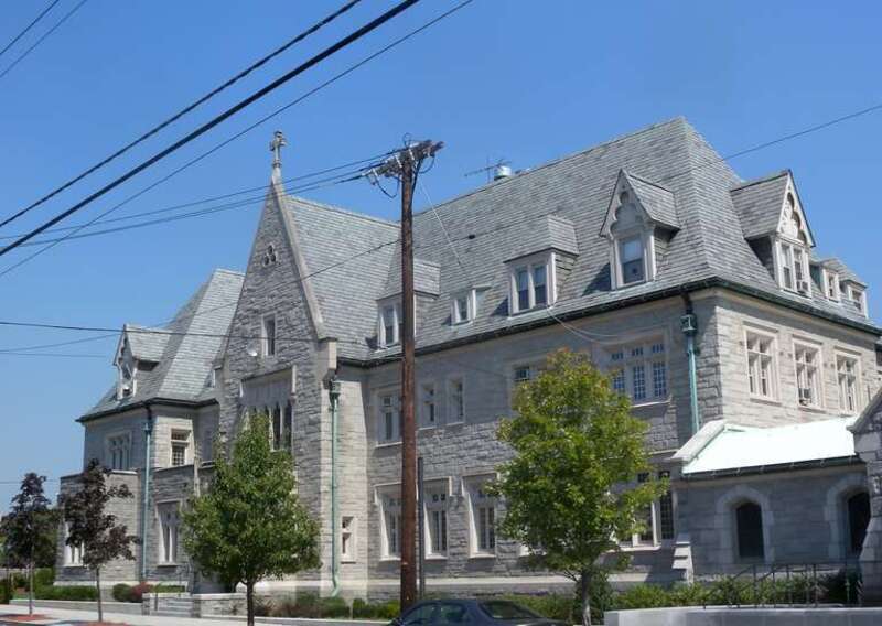Looking northeast from parking lot at building north of the Cathedral on a suny midday.