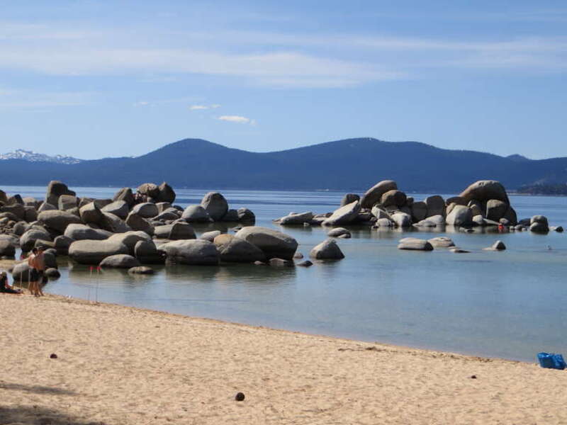 Lake Tahoe is a large freshwater lake in the Sierra Nevada of the United States. At a surface elevation of 6,225 ft (1,897 m), it is located along the border between California and Nevada, west of Carson City. Lake Tahoe is the largest alpine lake in