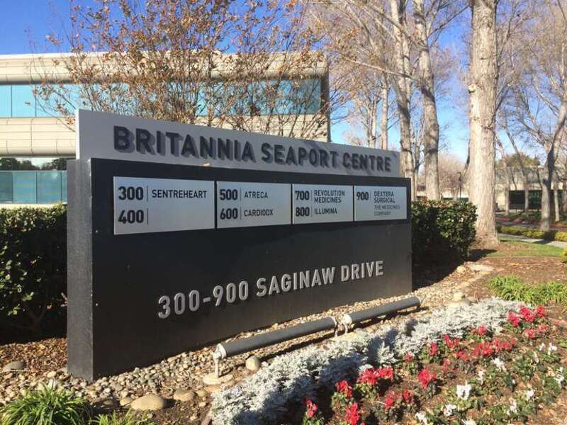 Business listing sign at Seaport Centre in Redwood City California listing: SentreHeart, Atreca, Cardiodx, Revolution Medicines, Illumina, and Dextera Surgical.