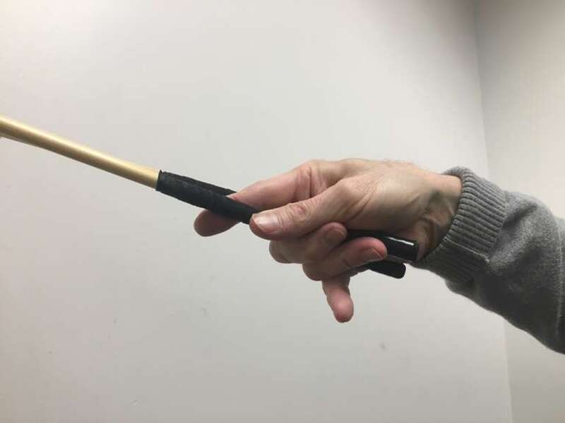 Small to mid, third finger holding outside mallet