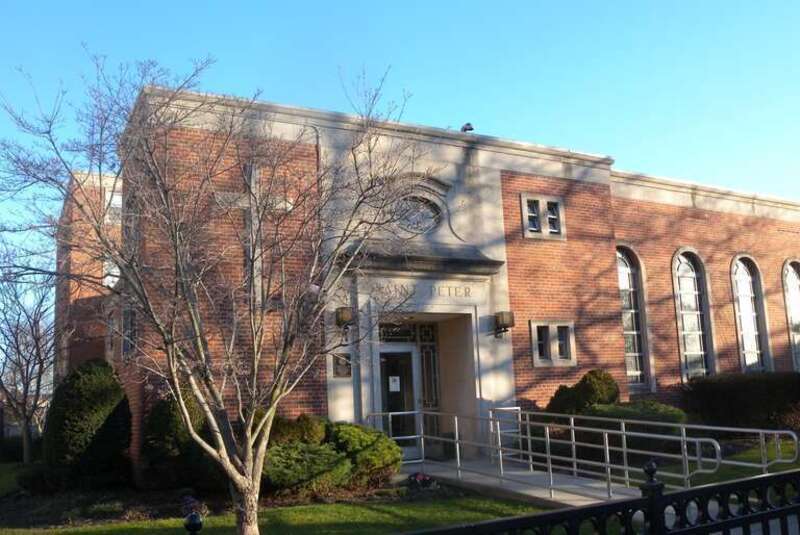 Looking southeast at St Peter Hall on a sunny late afternoon.