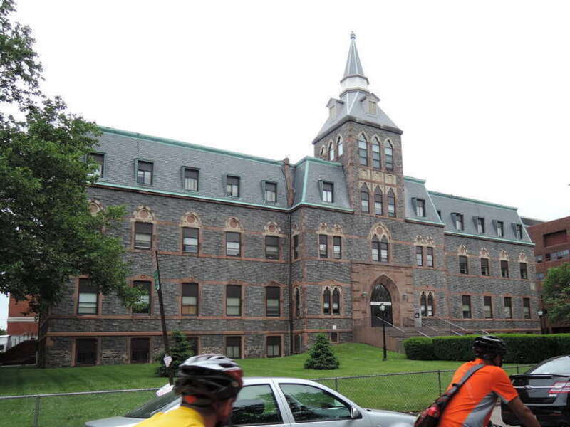 Looking northeast while biking past auditorium on a cloudy day.