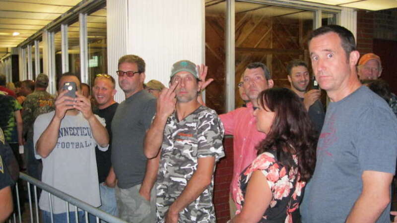People stand in line outside Toad's Place concert hall in New Haven, CT on 8/6/13 to see Ted Nugent. A protest event was held outside in response to inflammatory remarks made by Ted Nugent regarding the shooting of Trayvon Martin.