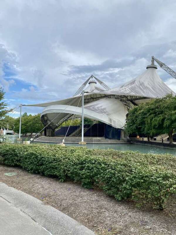 Built for the 1982 World’s Fair, this structure was designed by Horst Berger and McCarty Bullock and Holsaple Architects, and features seating for 1400 spectators, with the stage of the amphitheater backing up to the adjacent artificial pond on the